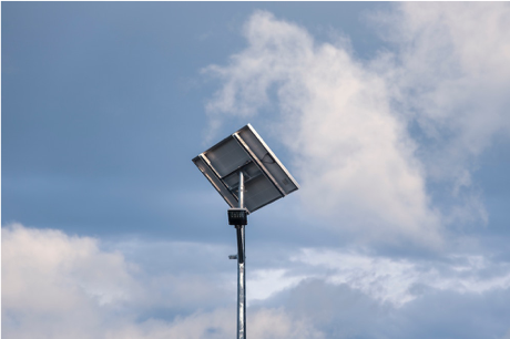 A solar panel with blue sky behind